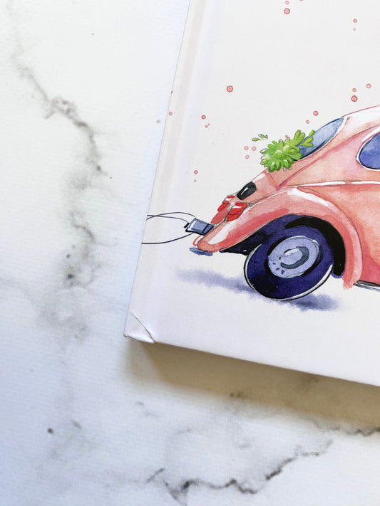 Reisetagebuch für Paare A5 Hardcover Mängelexemplar Honeymoon mit einer Zeichnung eines Autos auf dem Cover, ideal zum Planen und Festhalten von Reiseerlebnissen.