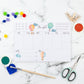 Wochenplaner Heißluftballons A5 Block zeigt handgemalte Heißluftballons und bietet Platz für Termine, Notizen und To-dos. Enthält 50 Blätter Naturpapier.