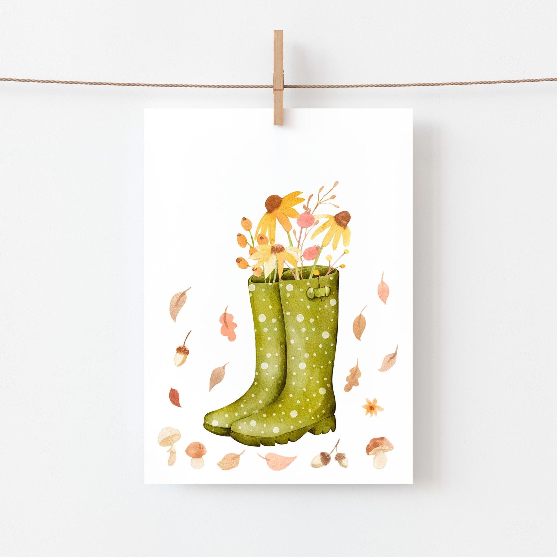 Postkarte Karte Herbstblumen A6 mit grünen Gummistiefeln voller Herbstblumen an einer Schnur aufgehängt, gedruckt auf hochwertigem, mattem Naturpapier.