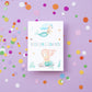 Karte Kindergeburtstag Meerjungfrauen mit handgemalten Meerjungfrauen und 'Herzlichen Glückwunsch' Schriftzug, ideal für kleine Meerjungfrauen-Fans.