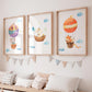 Posterset Himmelsstürmer mit Elefant, Hase und Fuchs in Heißluftballons, handgemalt, ideal für Kinderzimmerdeko, auf hochwertigem Naturpapier gedruckt.